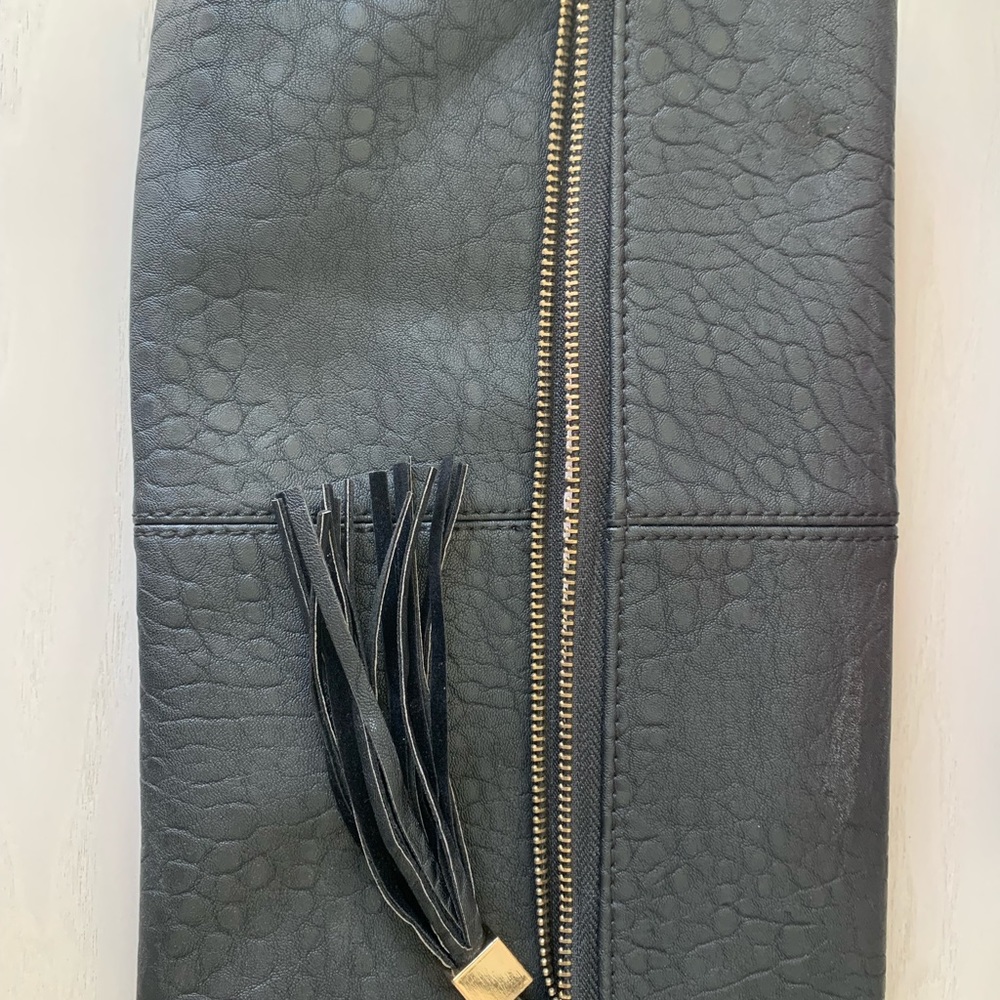 Black, gold, and white clutch